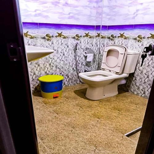 a bathroom with a toilet and a sink at Ella Rock Glance in Ella
