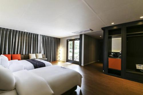 Postel nebo postele na pokoji v ubytování Daesungkwan Hot Spring Hotel