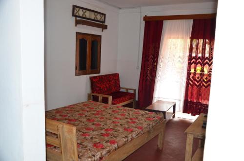 Llit o llits en una habitació de Villa Soaroby