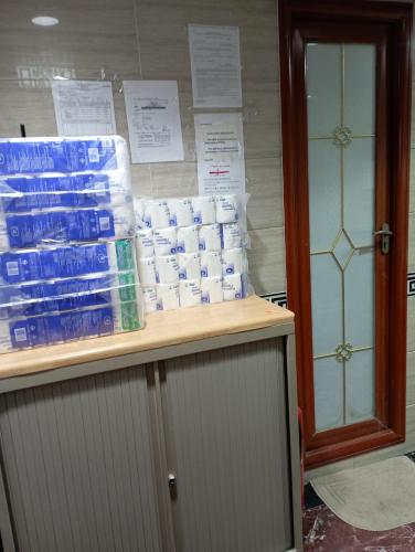 a store with stacks of toilet paper on a shelf at Everest Base Cam Hostel in Hong Kong