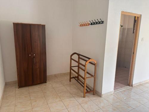 a room with a ladder next to a closet at Chamila's place in Nikawatawana