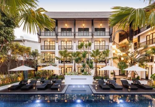 an image of a hotel with a swimming pool at Narinthra Heritage in Chiang Mai