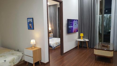 a hotel room with a bed and a mirror at Capsule Masterise Vinhomes in Gia Lâm Pho