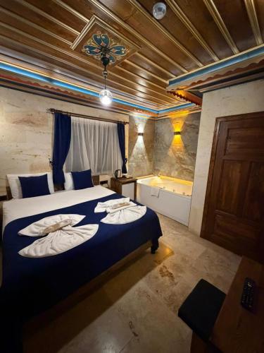 a bedroom with a bed with pillows on it at Era Cappadocia in Uçhisar