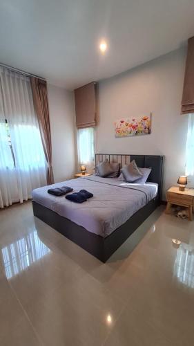a bedroom with a large bed in a room at Samati Hill - Sunset Pool Villa 7 - Klong Ning Beach in Ko Lanta Yai