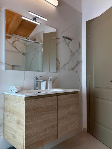 a bathroom with a sink and a mirror at Casa Rinata in Novigrad Istria