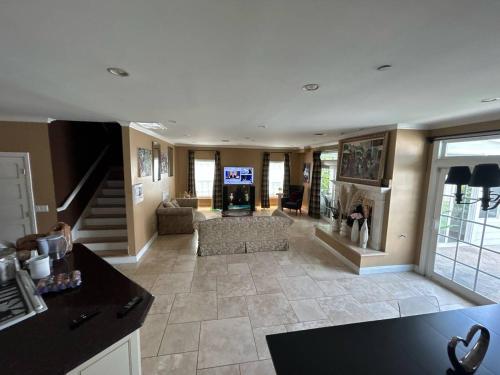 a large living room with a couch and a fireplace at Private room private balcony shared bathroom - Mini Mansion in Burbank