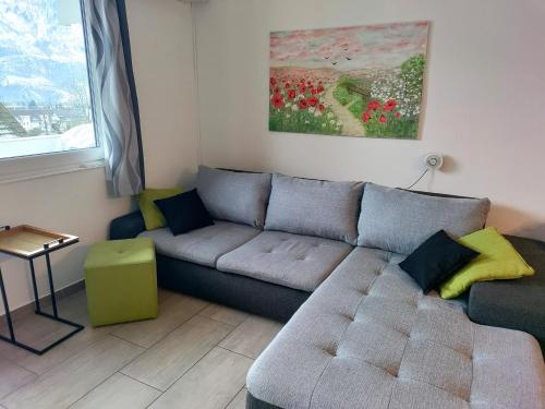 a living room with a couch and a table at Apartma Javoršček in Bovec