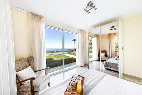 a bedroom with a view of the ocean at Villa Perla by Whale Homes in Lonato