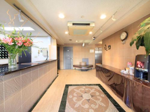 a hallway of a hospital with a waiting room at Hachioji Urban Hotel in Hachioji
