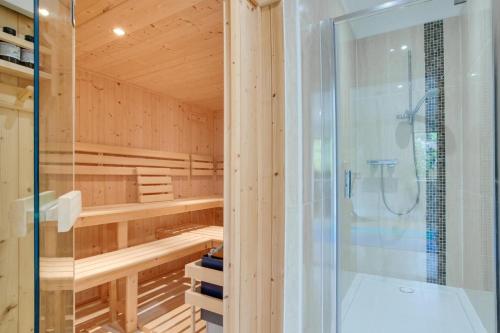 a bathroom with a sauna with a glass shower at 7 Bed in Ashton oc-p00891 in Germoe