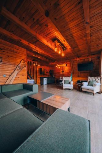 a large living room with couches and a table at Sapanca Ruby Bungalow in Sapanca