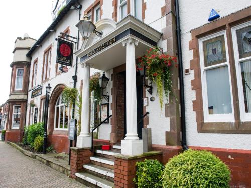 a building with a porch on a street at The County Hotel by Innkeeper's Collection in Lytham St Annes