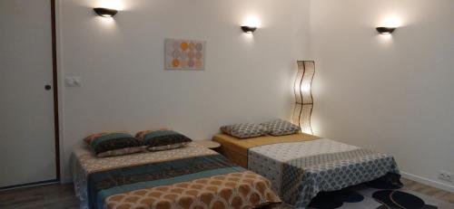 Giường trong phòng chung tại T2 + terrasse - Au cœur de tout