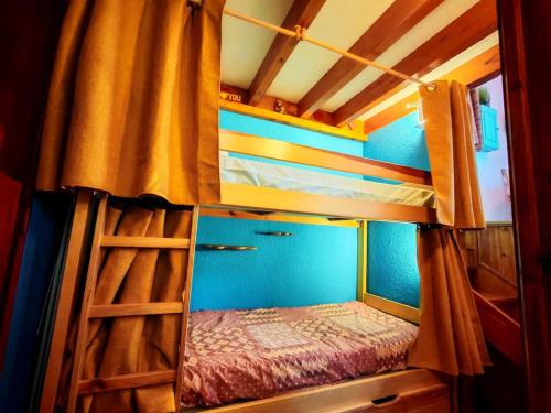 Lliteres en una habitació de Le Cozy
