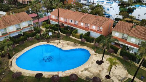 an overhead view of a swimming pool in a city at Pura Vida in Lepe
