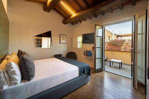 Postel nebo postele na pokoji v ubytování Hotel Milu Florence