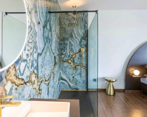 a bathroom with a shower with a mural on the wall at Nomad Village in Verviers