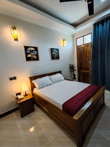 a bedroom with a large bed and a window at Serengeti space resort in Bunda