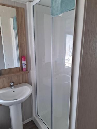 a bathroom with a shower and a sink at Life is Adventure in Great Clacton