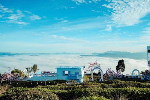 a view from the top of a hill with clouds at Cloud View Glamping Da Lat & Cloud 9 Săn Mây Cầu Đất in Da Lat