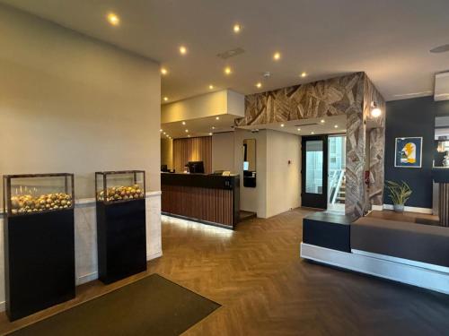 a lobby of a building with a display of food at S&A Vondel Park Hotel in Amsterdam