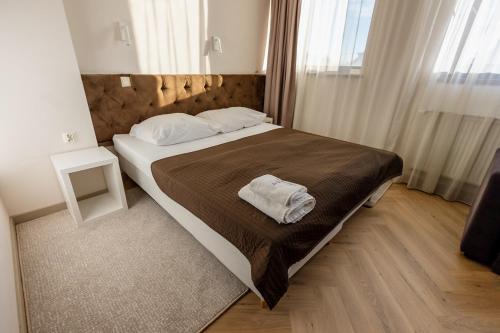 Gulta vai gultas numurā naktsmītnē Hotel Wena