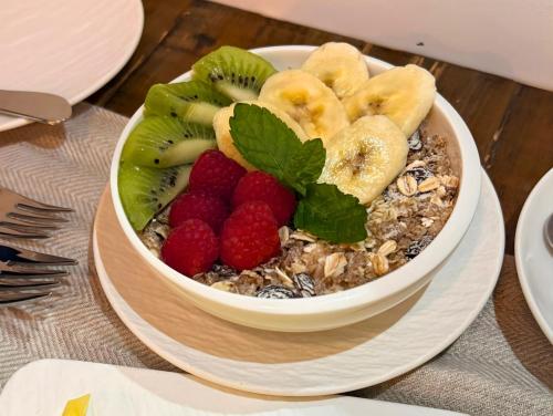 een schaal granen met fruit en noten op een bord bij VILLTAK La Maison - Adults Recommended Only in Marbella