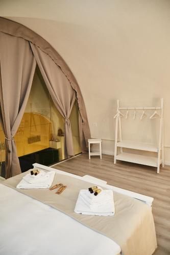 a room with a bed and a tent at Dimora Daliah&Oana in Matera