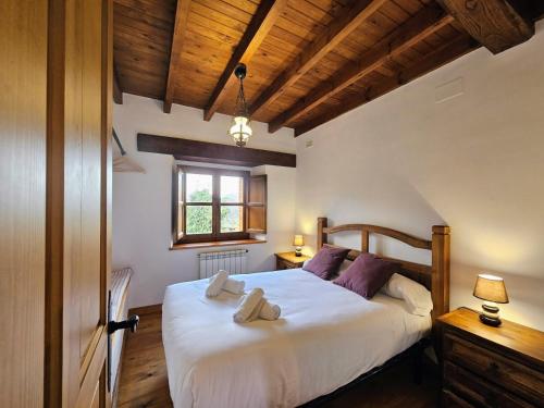 En eller flere senge i et værelse på El Rincon del Castro - Encanto Rural