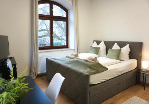 Postel nebo postele na pokoji v ubytování GreenTreeHomes - Stadtvilla Linde