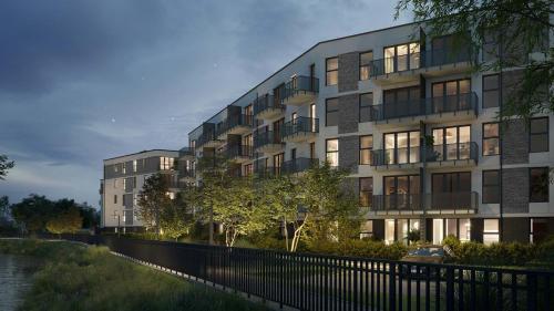 una rappresentazione di un edificio accanto a un fiume di Green Baltic Portovo Comfort Apartment City Center Balcony a Danzica