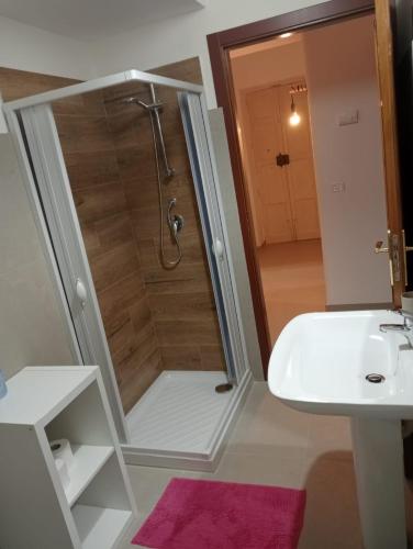 a bathroom with a shower and a sink at Penelope in Agrigento