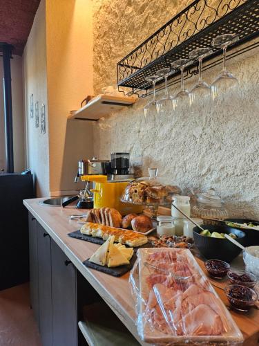 a buffet with many different types of food on a counter at Dolcevita guest house in Torreano
