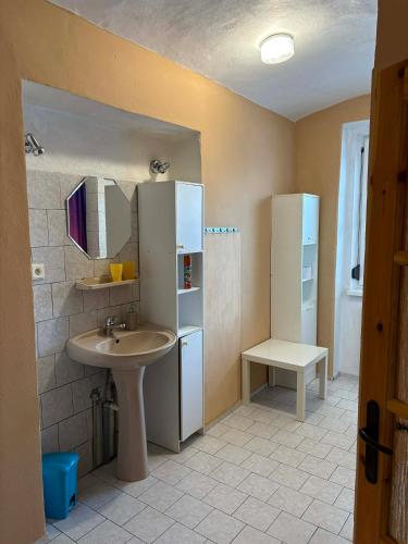 a bathroom with a sink and a mirror at Apartmány Somora in Doksy