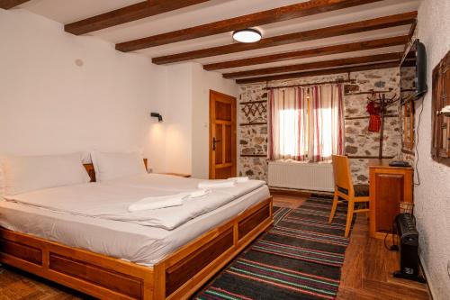 a bedroom with a bed in a room at Villa Martina in Smilyan