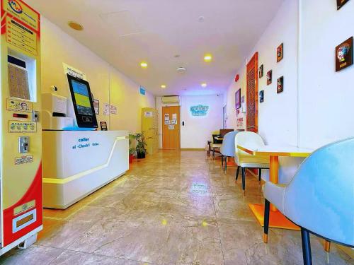 a room with tables and chairs in a pharmacy at Coller Chinatown in Singapore
