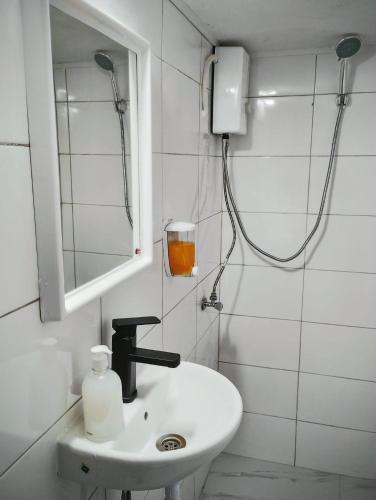 a bathroom with a sink and a shower at GuestHouse2 Karma369 in Plovdiv