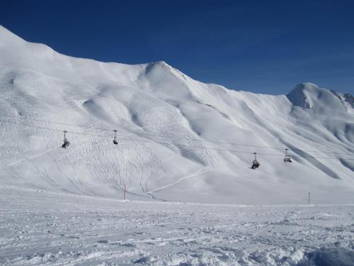 a snow covered mountain with a ski lift at Hotel Garni Alpendiamant in Fiss
