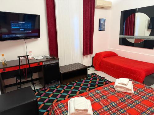 En eller flere senge i et værelse på B&B Villa Giglio