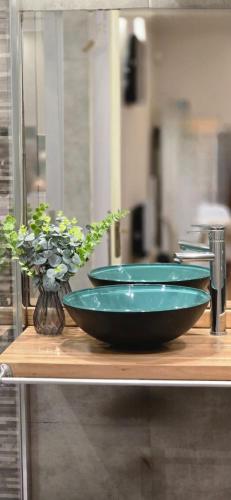 a group of bowls sitting on top of a counter at APART ALVARADO microcentro in Salta