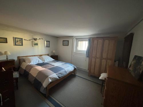 a bedroom with a bed and a window at Chez Zabou in Carpentras