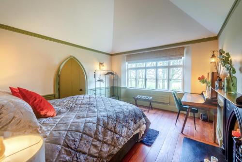 a bedroom with a bed and a desk and a window at 1 Bed in Linton oc-s31746 in Linton