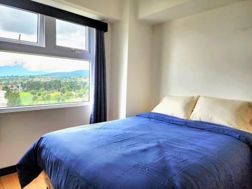 Llit o llits en una habitació de SkyView 13