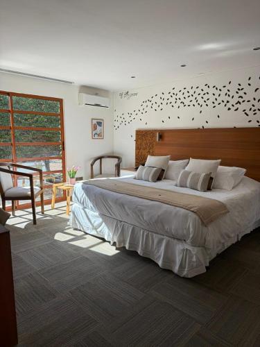 Llit o llits en una habitació de Hotel Origenes