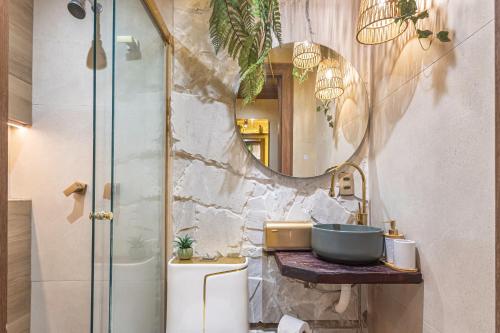 a bathroom with a sink and a mirror at Leblon Beach Hostel in Rio de Janeiro