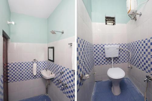 a blue and white bathroom with a toilet and a sink at Star Hospitality in kolkata