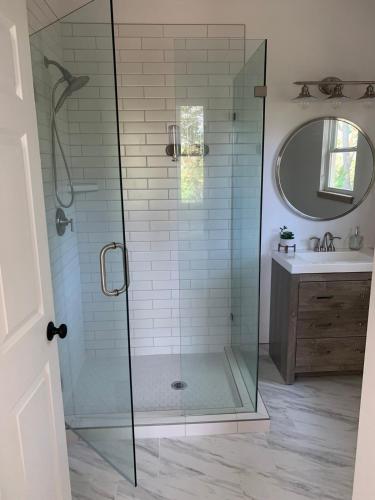 a shower with a glass door in a bathroom at Sautee Nacoochee Studio near Helen in Sautee Nacoochee