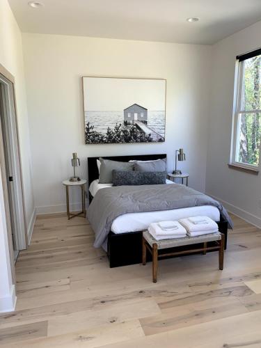 a bedroom with a bed and a picture on the wall at Sautee Nacoochee Studio near Helen in Sautee Nacoochee