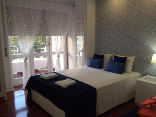 Postel nebo postele na pokoji v ubytování 4U Lisbon IV Guesthouse Airport